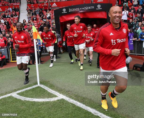 Louis Saha and Mikael Silvestre of Manchester United Legends warm up ahead of the Manchester United v Liverpool: Legends of the North match in aid of...