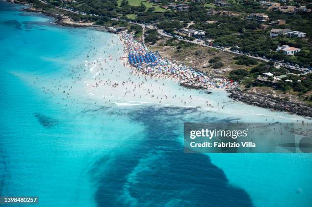 Aerial view, from a helicopter, of the crystal-clear sea of la Pelosa beach, located in the north of Sardinia in the province of Sassari on July 16,...