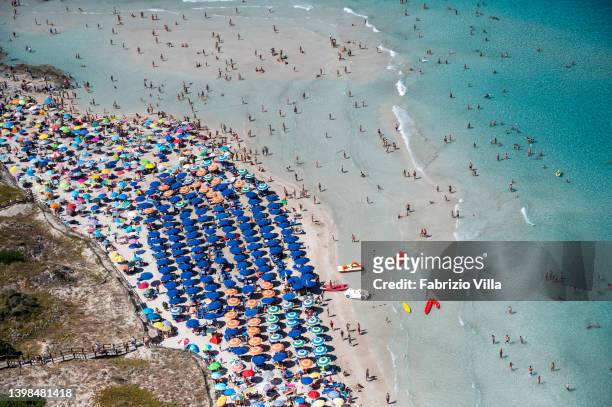 Aerial view, from a helicopter, of the crystal-clear sea of la Pelosa beach, located in the north of Sardinia in the province of Sassari on July 16,...