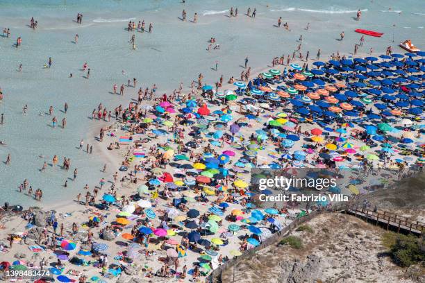 Aerial view, from a helicopter, of the crystal-clear sea of la Pelosa beach, located in the north of Sardinia in the province of Sassari on July 16,...