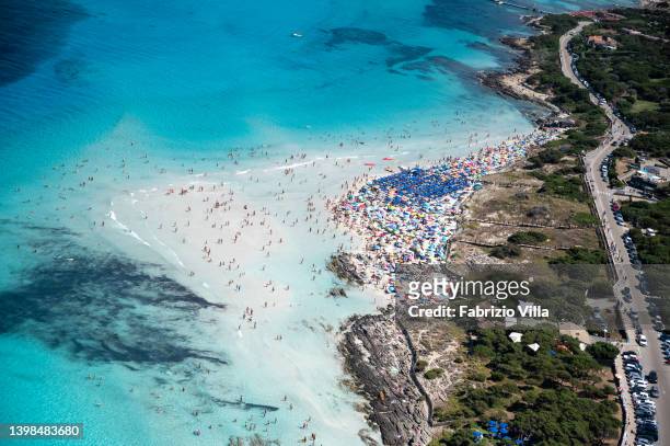 Aerial view, from a helicopter, of the crystal-clear sea of la Pelosa beach, located in the north of Sardinia in the province of Sassari on July 16,...