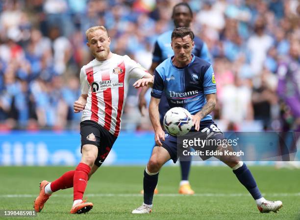 Josh Scowen of Wycombe Wanderers battles for possession with Alex Pritchard of Sunderland during the Sky Bet League One Play-Off Final match between...