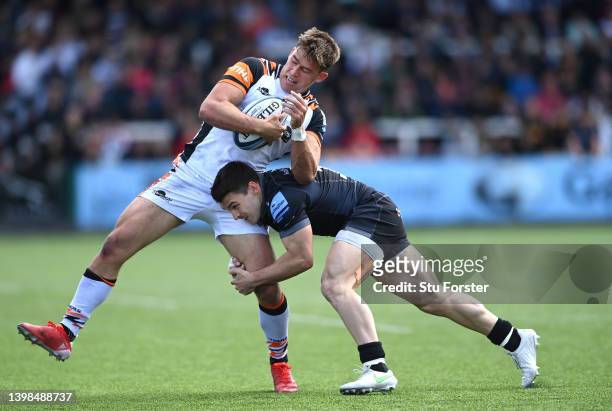 Tigers centre Guy Porter is tackled by Falcons wing Mateo Carreras during the Gallagher Premiership Rugby match between Newcastle Falcons and...