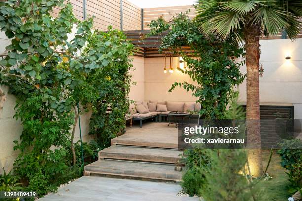 secluded outdoor patio and foliage - courtyard stock pictures, royalty-free photos & images