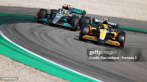 Lando Norris of Great Britain driving the McLaren MCL36 Mercedes leads Lewis Hamilton of Great Britain driving the Mercedes AMG Petronas F1 Team W13...