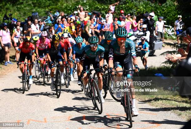 Jai Hindley of Australia and Wilco Kelderman of Netherlands and Team Bora - Hansgrohe leads the peloton while fans cheer during the 105th Giro...