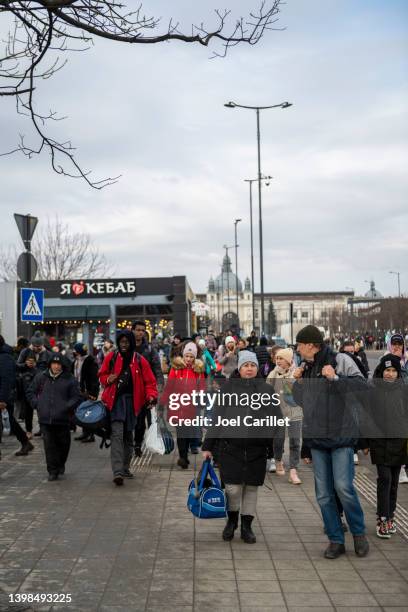 people outside the train station in lviv, ukraine - displaced stock pictures, royalty-free photos & images