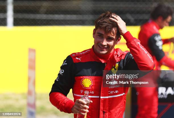 Pole position qualifier Charles Leclerc of Monaco and Ferrari smiles in parc ferme during qualifying ahead of the F1 Grand Prix of Spain at Circuit...