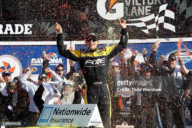 James Buescher, driver of the Fraternal Order of Eagles Chevrolet, celebrates in Victory Lane after winning the NASCAR Nationwide Series DRIVE4COPD...