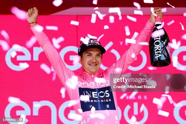 Richard Carapaz of Ecuador and Team INEOS Grenadiers celebrates winning the pink leader jersey on the podium ceremony after the 105th Giro d'Italia...