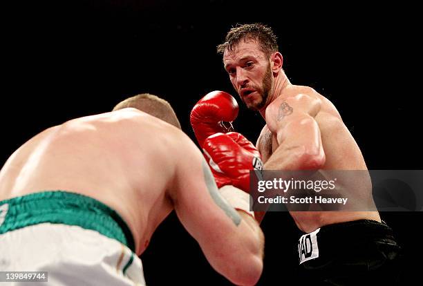 Enzo Maccarinelli in action with Ciaran Healy during their Cruiserweight bout at the Motorpoint Arena on February 25, 2012 in Cardiff, Wales.