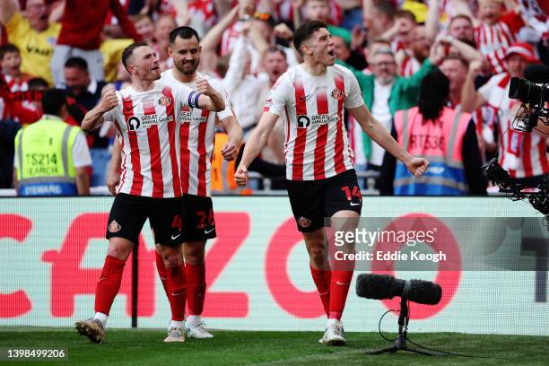 Ross Stewart of Sunderland celebrates with teammates Corry Evans and Bailey Wright after scoring their side's second goal during the Sky Bet League...