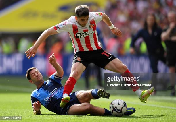 Lynden Gooch of Sunderland is challenged by Joe Jacobson of Wycombe Wanderers during the Sky Bet League One Play-Off Final match between Sunderland...