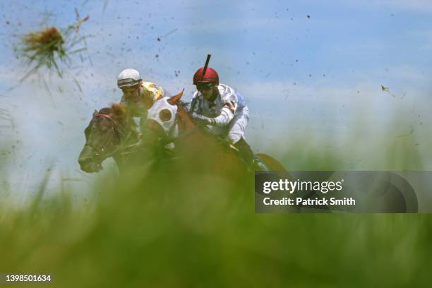 Jockey Angel Suarez rides General's Duty as he races against jockey Joel Rosario riding Amarillo in an undercard race prior to the 147th Running of...