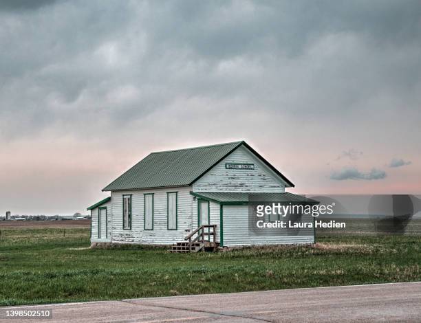 old abandoned schoolhouse on the great plains - rural iowa stock pictures, royalty-free photos & images