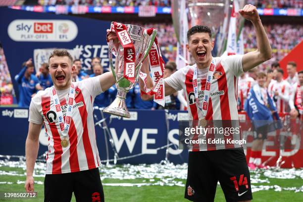 Elliot Embleton and Ross Stewart of Sunderland celebrate with the Sky Bet League One Play-Off trophy following victory in the Sky Bet League One...