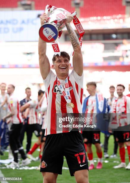 Dennis Cirkin of Sunderland celebrates with the Sky Bet League One Play-Off trophy following victory in the Sky Bet League One Play-Off Final match...