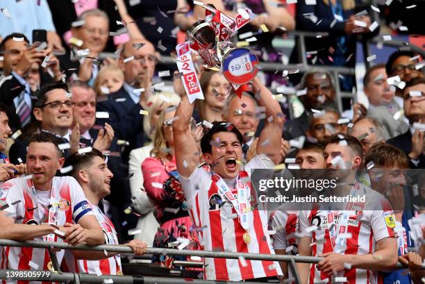 Luke O'Nien of Sunderland celebrates with the Sky Bet League One Play-Off trophy following victory in the Sky Bet League One Play-Off Final match...