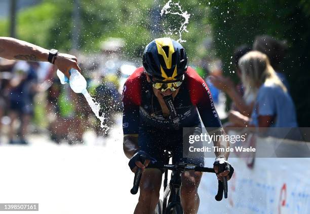 Richard Carapaz of Ecuador and Team INEOS Grenadiers competes whilst a fan refresh him during the 105th Giro d'Italia 2022, Stage 14 a 147km stage...