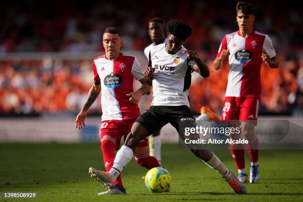 Iago Aspas of Celta Vigo battles for possession with Thierry Correia of Valencia during the LaLiga Santander match between Valencia CF and RC Celta...