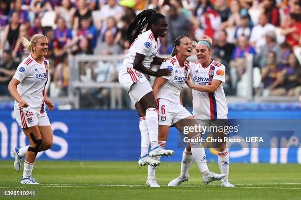 Amandine Henry celebrates with teammate Ellie Carpenter of Olympique Lyonnais after scoring their team's first goal during the UEFA Women's Champions...