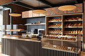 Bakery Shop Interior. Close-up View Of Bakery Counter With Freshly Baked Food And Buns.