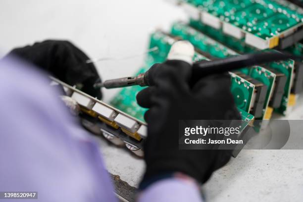 soldering to electronic board - soldered stock pictures, royalty-free photos & images