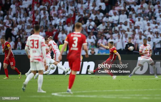 Maximilian Eggestein of SC Freiburg scores their side's first goal during the final match of the DFB Cup 2022 between SC Freiburg and RB Leipzig at...