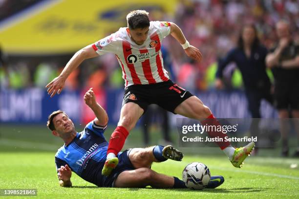 Lynden Gooch of Sunderland is challenged by Joe Jacobson of Wycombe Wanderers during the Sky Bet League One Play-Off Final match between Sunderland...