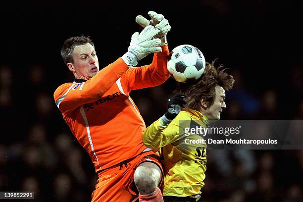 Robert Cullen of VVV Venlo battles for the ball with goalkeeper, Remko Pasveer of Heracles during the Eredivisie match between VVV Venlo and SC...