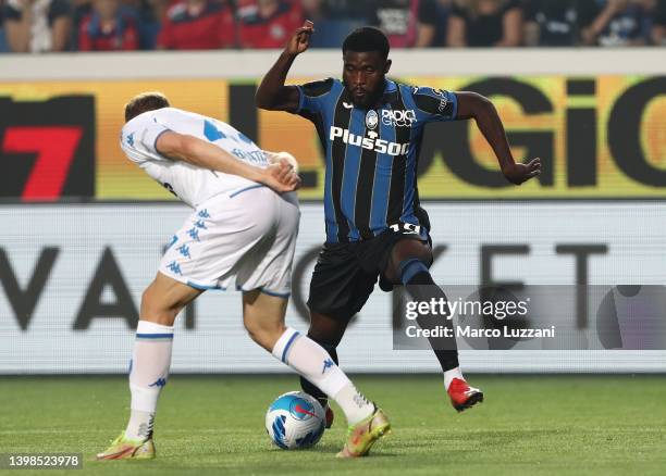 Jeremie Boga of Atalanta BC is challenged by Szymon Zurkowski of Empoli Calcio during the Serie A match between Atalanta BC and Empoli FC at Gewiss...