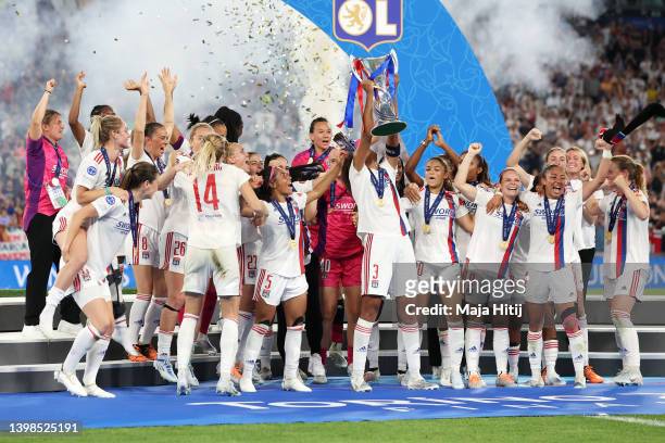 Wendie Renard of Olympique Lyonnais lifts the UEFA Women's Champions League following victory in the UEFA Women's Champions League final match...