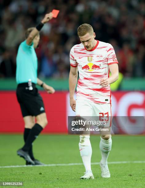 Marcel Halstenberg of RB Leipzig reacts after being shown a red card during the final match of the DFB Cup 2022 between SC Freiburg and RB Leipzig at...