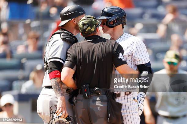 Umpire Nick Mahrley attempts to separate Yasmani Grandal of the Chicago White Sox and Josh Donaldson of the New York Yankees during the fifth inning...