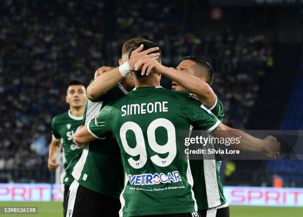 Giovanni Simeone of Hellas Verona FC celebrates with teammates after scoring the first goal of his team during the Serie A match between SS Lazio and...