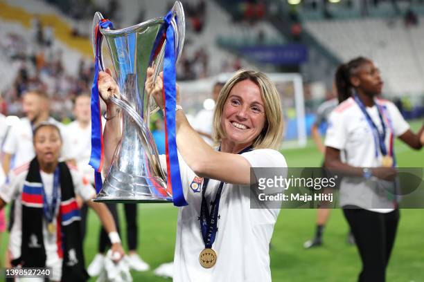 Sonia Bompastor, Head Coach of Olympique Lyonnais celebrates with the UEFA Women's Champions League trophy following victory in the UEFA Women's...