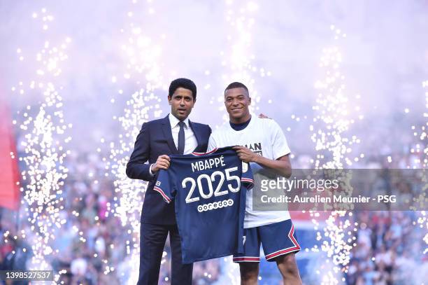 Kylian Mbappé poses with PSG President, Nasser Al-Khelaifi after extending his contract with the PSG prior to the Ligue 1 Uber Eats match between...