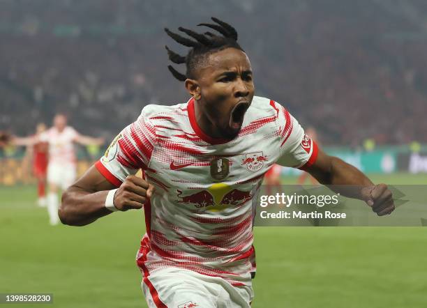 Christopher Nkunku of RB Leipzig celebrates after scoring their side's first goal during the final match of the DFB Cup 2022 between SC Freiburg and...
