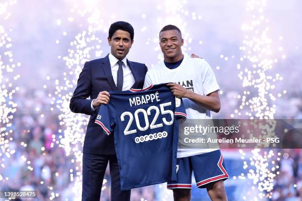 Kylian Mbappé poses with PSG President, Nasser Al-Khelaifi after extending his contract with the PSG prior to the Ligue 1 Uber Eats match between...