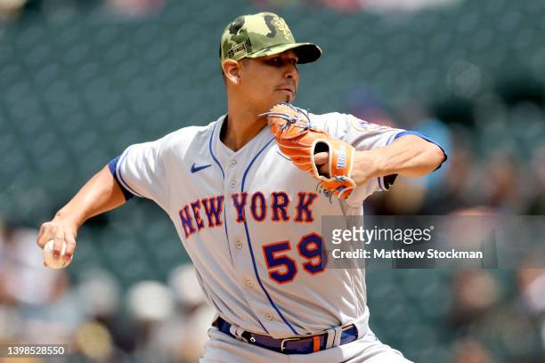 Starting pitcher Carlos Carrasco of the New York Mets throws against the Colorado Rockies in the first inning during Game One of double header at...