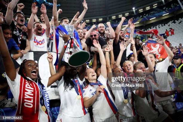 Griedge M'Bock Bathy and teammates of Olympique Lyonnais celebrates with the UEFA Women's Champions League trophy following victory in the UEFA...