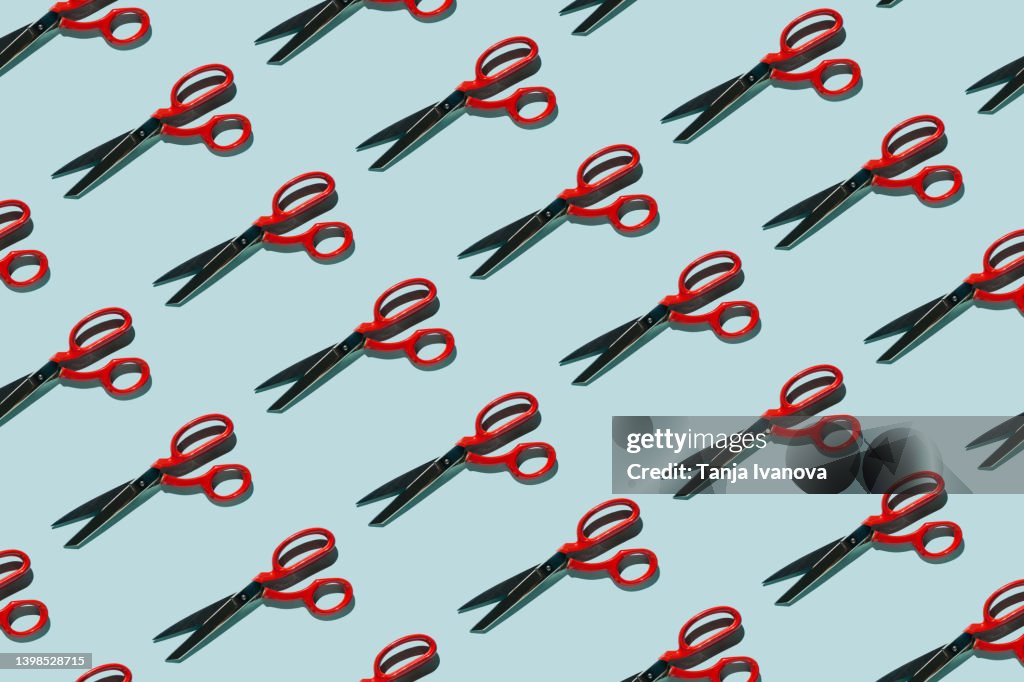 Pattern of scissors on blue background