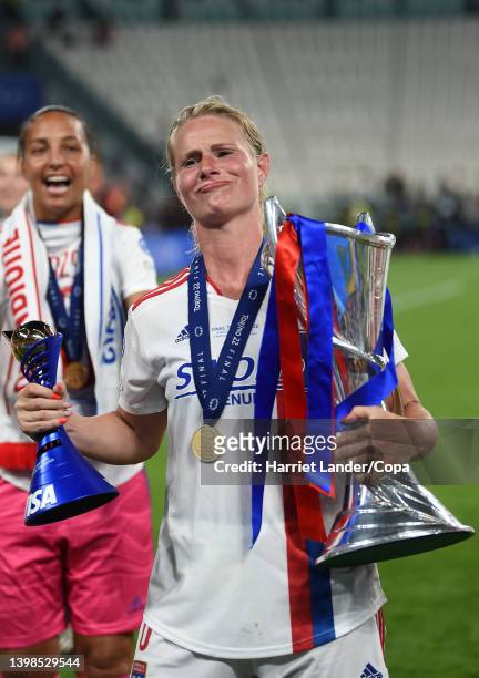 Amandine Henry of Olympique Lyon celebrates with VISA Player of the Match award and the UEFA Women's Champions League Trophy following her team's...