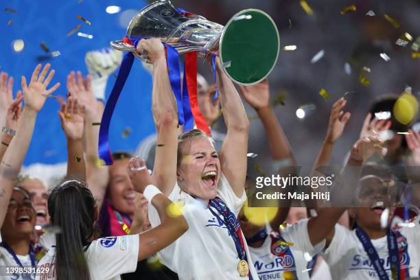 Ada Hegerberg of Olympique Lyonnais lifts the UEFA Women's Champions League trophy after their sides victory during the UEFA Women's Champions League...