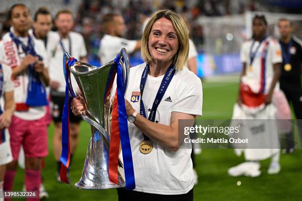 Coach Sonia Bompastor of Olympique Lyonnais celebrate with the trophy after winning the UEFA Women's Champions League after the UEFA Women's...