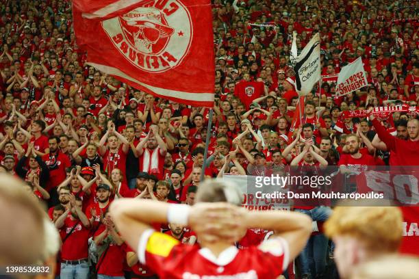 Freiburg fans applaud their side after their sides defeat in the penalty shoot out during the final match of the DFB Cup 2022 between SC Freiburg and...