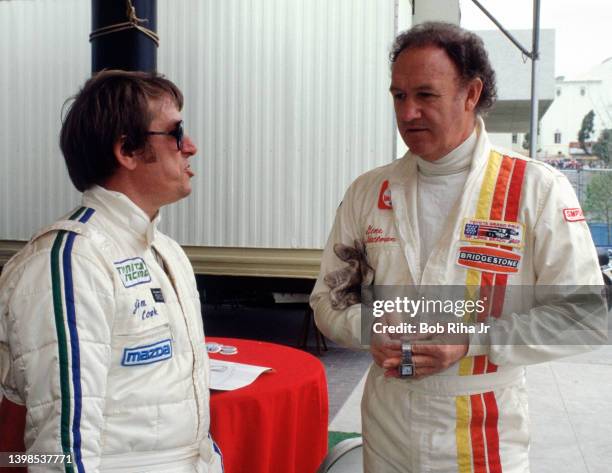 Pro driver Jim Cook talks with Actor Gene Hackman at the Toyota Celebrity/Long Beach Grand Prix Race, March 14, 1981 in Long Beach, California.