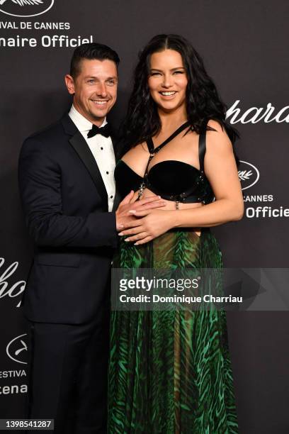 Andre Lemmers and Adriana Lima attend the Chopard Host The Dinner 'Chopard Loves Cinema' at the Hotel Martinez on May 21, 2022 in Cannes, France.