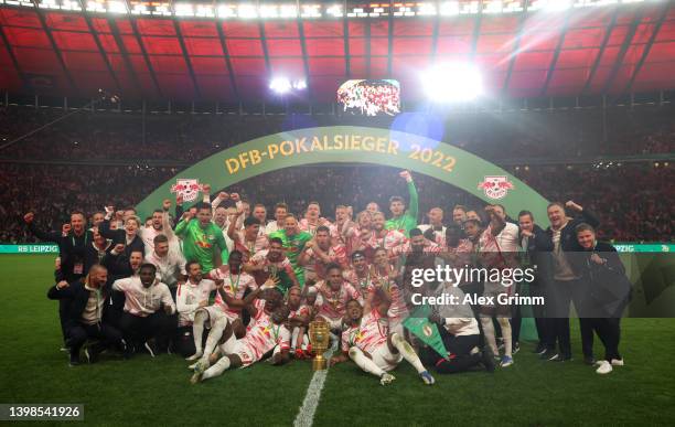 Leipzig players celebrate with the DFB-Pokal trophy after their sides victory during the final match of the DFB Cup 2022 between SC Freiburg and RB...
