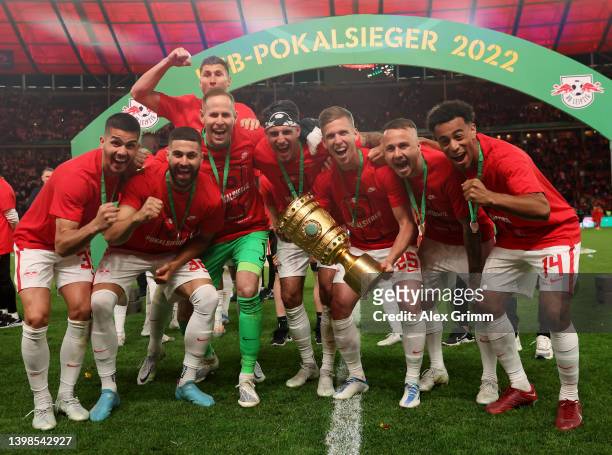 Dani Olmo of RB Leipzig celebrates with teammates and with the DFB-Pokal trophy after their sides victory during the final match of the DFB Cup 2022...